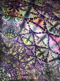 a close up of a colorful tie dyed fabric