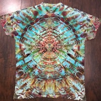 a tie dye shirt with a colorful design on it